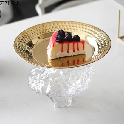 Ornate gold-toned hammered metal dessert plate with clear textured glass pedestal base for elegant glass fruits bowl use