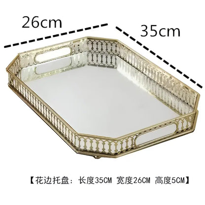 Ornate gold mirror glass storage tray with a gold-toned metal base and beaded border for bedroom jewelry decor