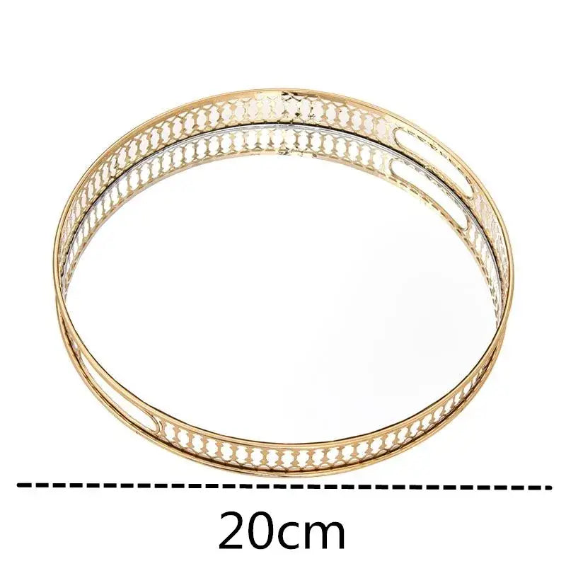 Ornate gold mirror glass storage tray with an openwork metal frame and mirrored center for jewelry decor