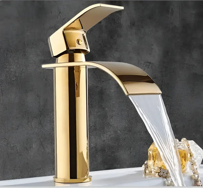 Gold waterfall bathroom faucet with ornate floral design sleek modern curved spout decorbites gold waterfall tap