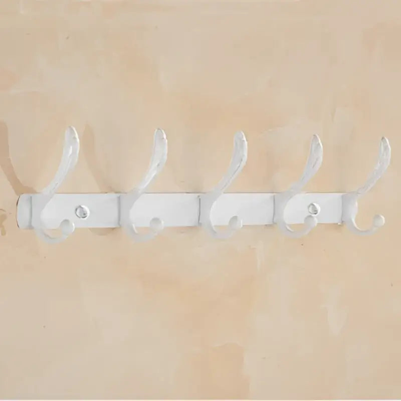 White metal coat rack with five curved hooks from ornate gold and white ceramic decorbites bathroom accessories set