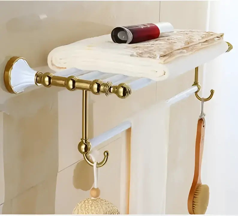 Ornate gold-toned bathroom towel rack with ceramic detailing and matching hooks from decorbites bathroom accessories set