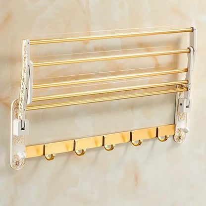Ornate gold and white floral multi-tiered wall-mounted towel rack with decorative side panels in decorbites bathroom accessories set