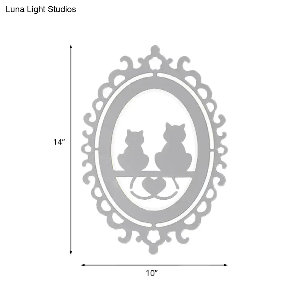 Ornate gray cat silhouette led wall light inch fixture featuring silver oval art with two cats on a bench and scalloped border