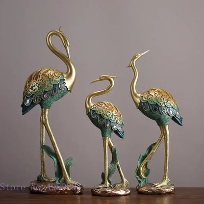 Ornate teal and gold crane bird sculpture with intricate feather patterns for living room decor by decorbites