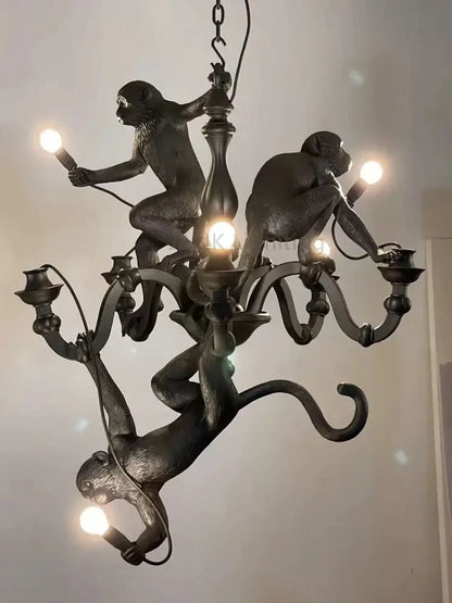 Dark bronze monkeys pendant chandelier with sculpted primates and ornate metal arms for living room decor