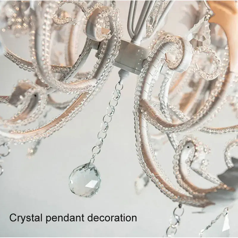 Elegant white decorbites iron crystal chandelier with intricate silver-toned metalwork and faceted clear crystals