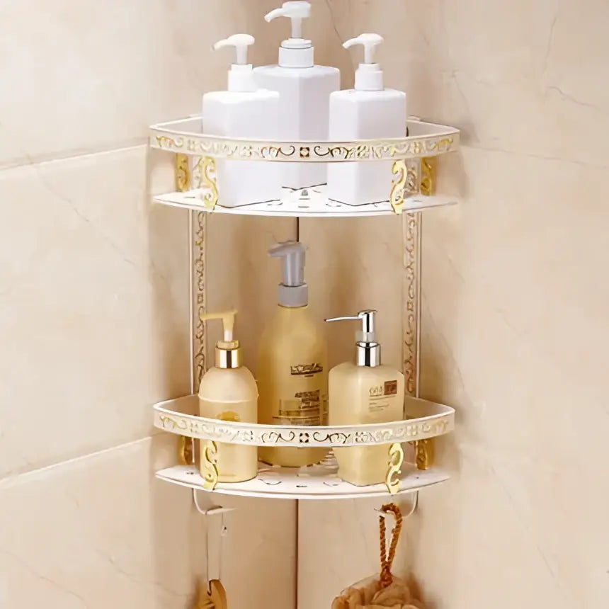 Ornate white and gold corner shower caddy with three tiers holding toiletries from decorbites bath hardware set