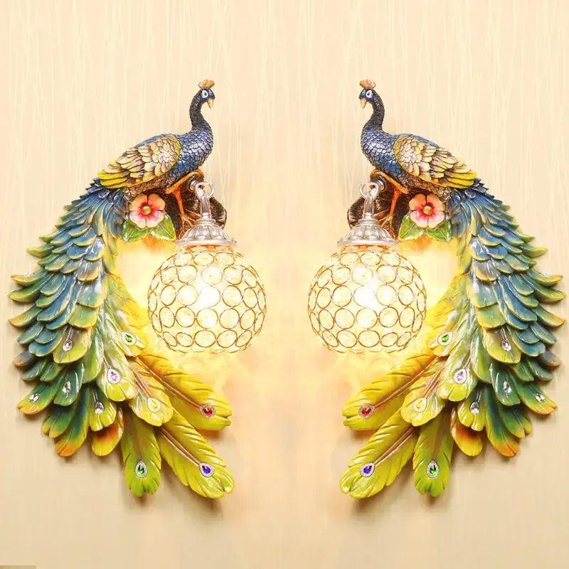 Ornate white gold peacock crystal wall lamp pair with iridescent feathers and spherical crystal-encrusted lights for decorbites gold peacock decor