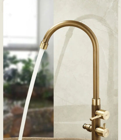 Antique brass single hole gooseneck kitchen faucet with dual control knobs and 360° swivel spout for outdoor use