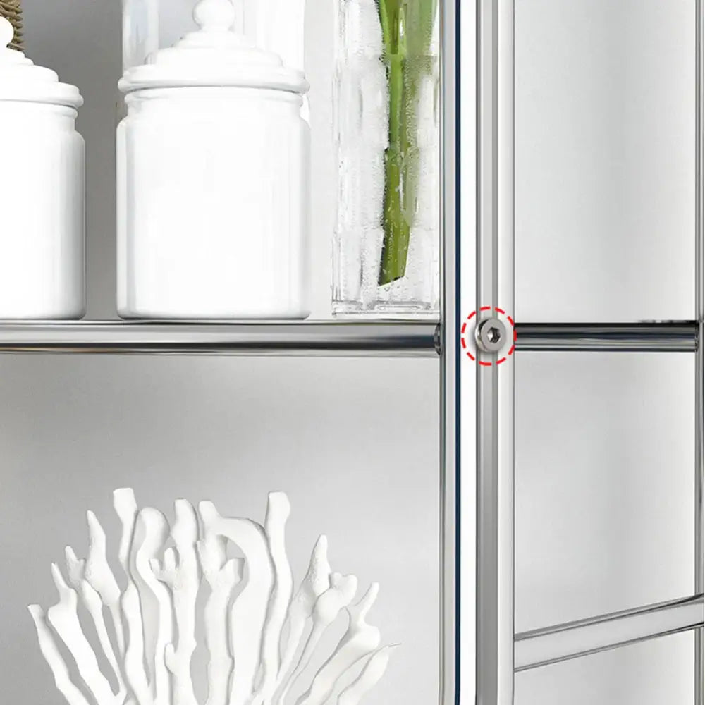 Silver-toned metal hinge on a modern cabinet door of the decorbites 3-tier over toilet metal storage shelf for vertical space