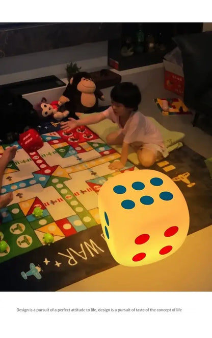 A glowing yellow oversized dice night lamp with blue and red dots featuring colorful remote control for bedroom decor