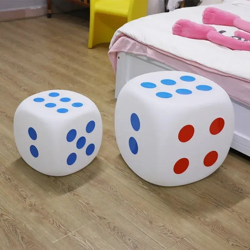 White foam dice-shaped stools with blue and red dots featuring decorbites colorful remote control for bedroom use