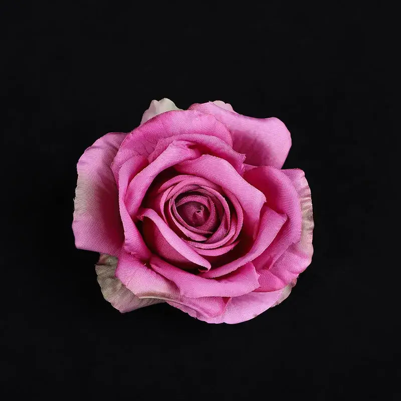 A delicate pink silk rose with soft layered petals and cream edges from a pastel 30pcs silk roses decor set