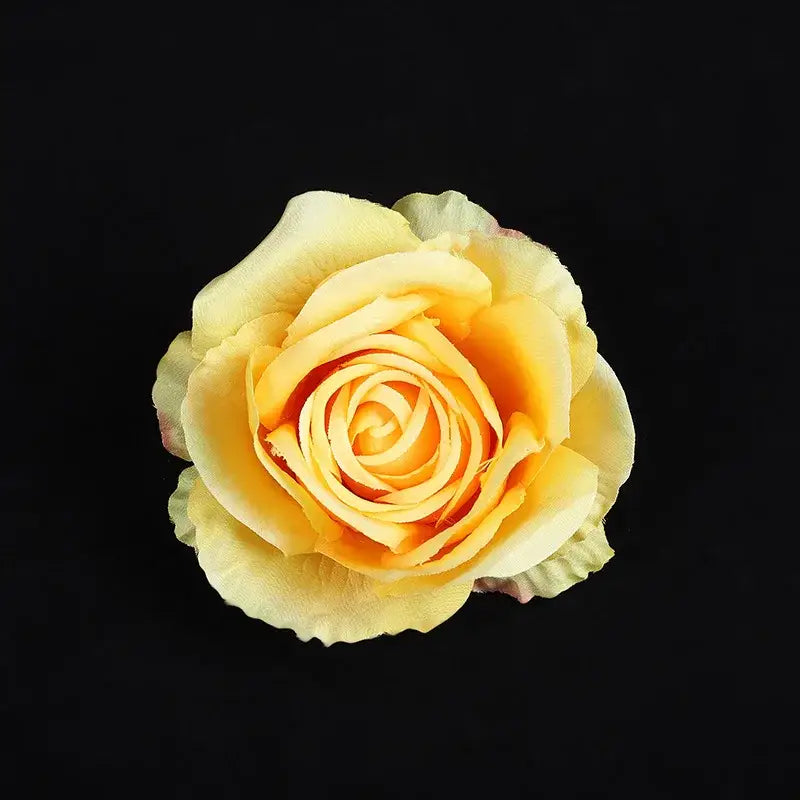 A delicate yellow silk rose with softly layered petals in a pastel 30pcs silk roses set for wedding and living room decor