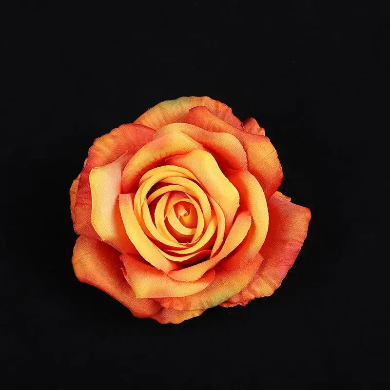 A vibrant gradient orange silk rose with layered petals from yellow to coral in 30pcs silk roses floral decor
