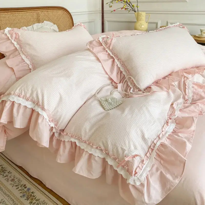 Pink ruffled cotton pillowcases with white lace trim in pastel blue pink lattice bedding set by decorbites