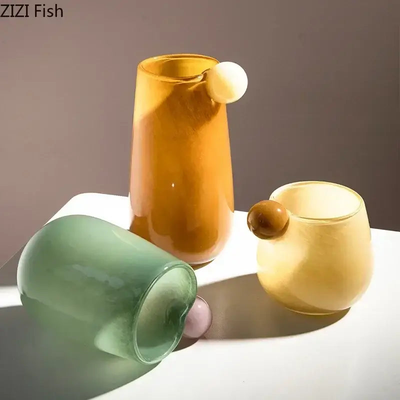 Tall amber glass vase with smooth rounded handle and subtle gradient finish, a colorful glass vase for living room decor
