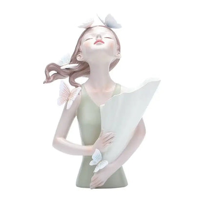 A delicate porcelain butterfly girl figurine in pale green dress with white butterflies for flower vase decor