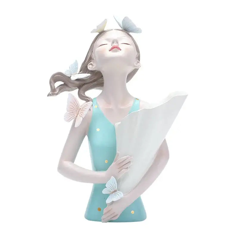 A serene resin butterfly girl flower vase ornament with light blue dress and gold polka dots for living room decor