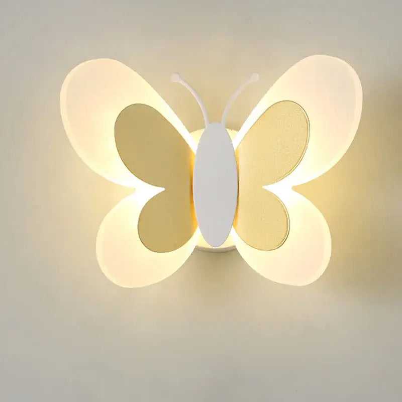 Softly glowing pastel butterfly wall lamp with translucent warm-toned wings and white body for kids bedroom decorbites butterfly wall lamp