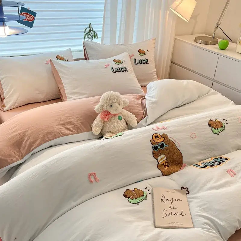 White duvet cover with embroidered brown bear and pink musical notes from decorbites cartoon embroidered cotton bedding set