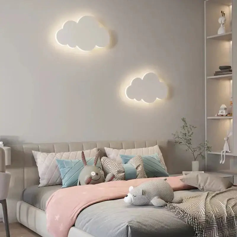 Two white cloud led wall lamps with soft glowing illumination perfect for kids bedroom decorbites cloud led lighting