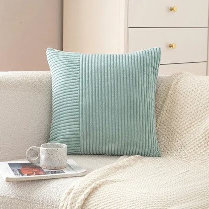 A soft mint green corduroy striped body pillow with textured ribbed fabric for bedroom lumbar support by decorbites