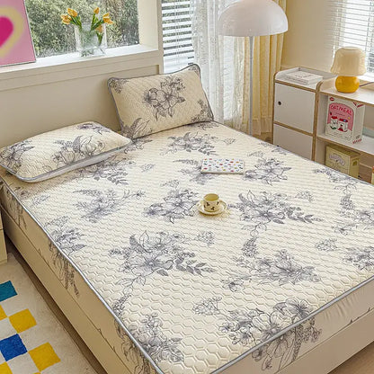 Beige quilted latex fitted sheet set with gray floral embroidery and subtle hexagonal texture for bedroom bed pad
