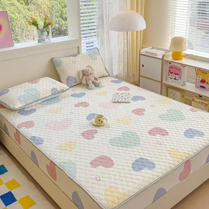Pastel floral quilted latex fitted sheet set with heart-patterned pastel colors and soft textured surface