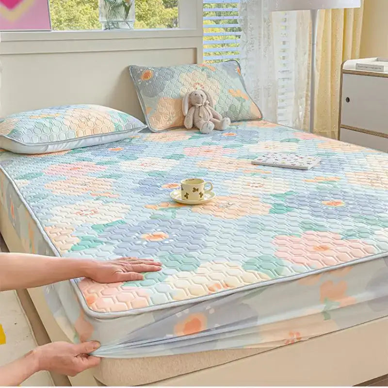 Pastel floral quilted latex fitted sheet set with soft breathable fabric in blues pinks and greens for bedroom use