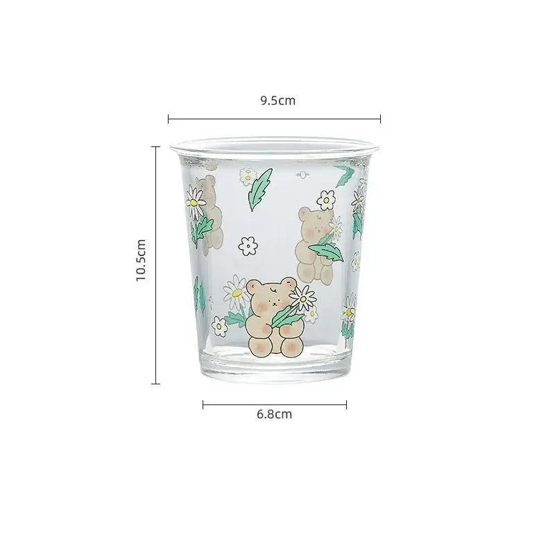 Clear glass bear rabbit glass tea cup with beige teddy bears holding daisies and subtle glitter accents for coffee use
