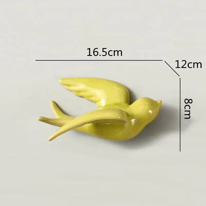 Glossy yellow flying bird ceramic wall ornament with outstretched wings and sleek minimalist design for living room decor