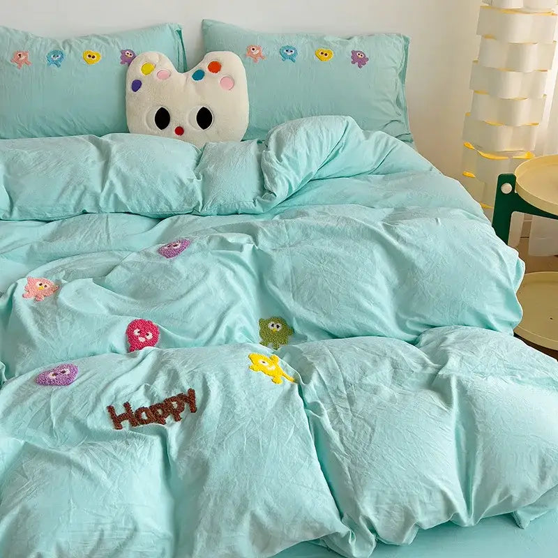 Pastel green quilted bedding set with colorful decorbites cartoon embroidery and happy stitched in brown thread