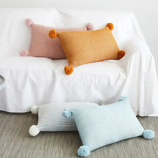 Pastel knit pompom ball cushion cover in pink orange and light blue with textured woven patterns for bedroom decorbites decor