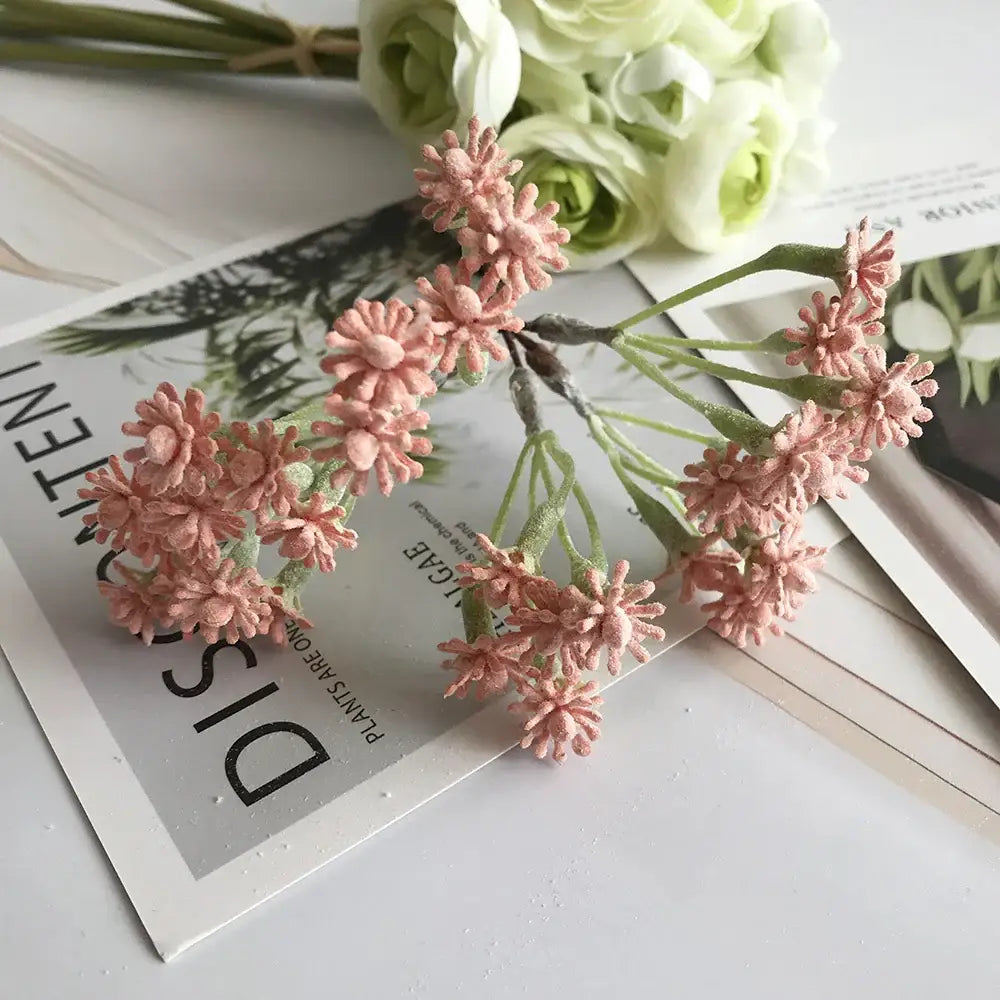 A pastel multi color decorbites decorative vase set with a bouquet of pink artificial flowers for living room decor