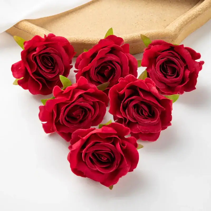 Vibrant red artificial flowers with detailed petal layers and green leaves from decorbites 100pcs multicolor silk wedding decor