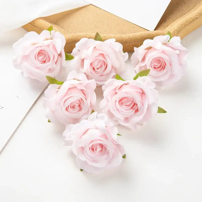 Delicate pink artificial flowers with soft layered petals and small green stems from decorbites 100pcs multicolor silk set