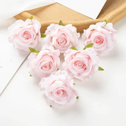Delicate pink artificial flowers with soft layered petals and small green stems from decorbites 100pcs multicolor silk set