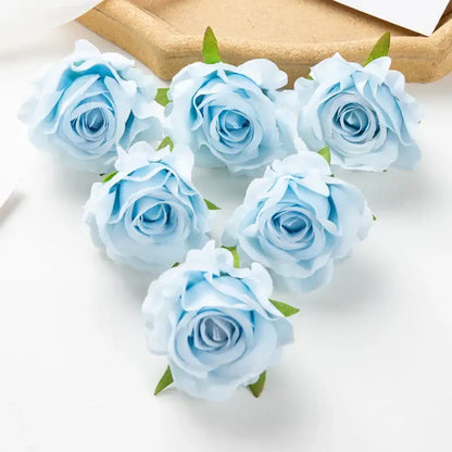Delicate light blue artificial flowers with soft layered petals and small green stems in decorbites 100pcs multicolor silk set