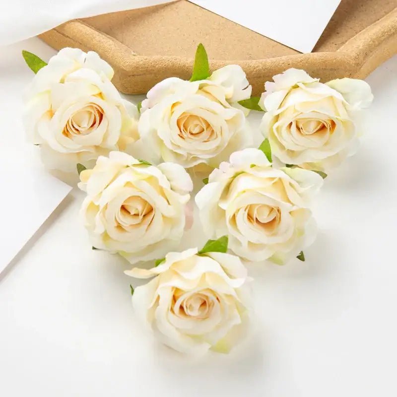Cream-colored artificial flowers with delicate petals and green stems from decorbites 100pcs multicolor silk wedding decor