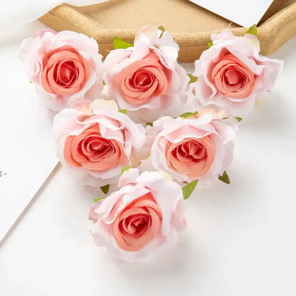 Six delicate peach and white artificial flowers with layered petals and green leaves from decorbites 100pcs multicolor silk set