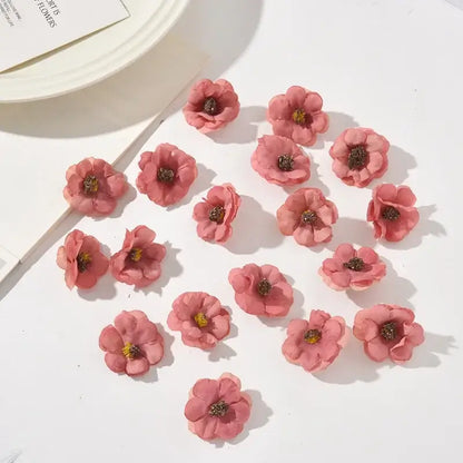 Pastel pink and lavender decorbites mini daisy artificial flowers with delicate petals and dark brown centers for wedding decor