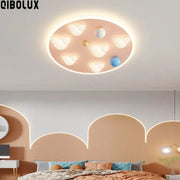 Pastel pink oval ceiling light with white and blue spherical accents for decorbites cloud shape ceiling bedroom decor