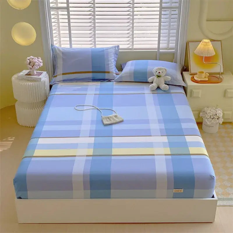 Pastel pink and blue cotton striped fitted sheet featuring a blue and white plaid design with light yellow stripes decorbites cotton striped bedding