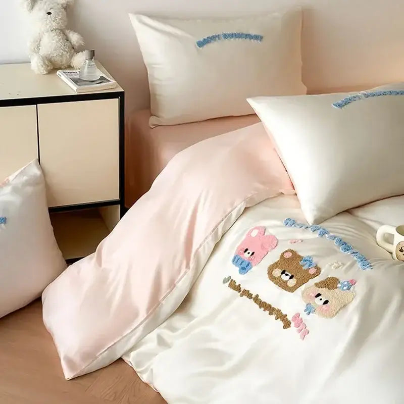 Cream-colored satin duvet cover with pastel pink cartoon embroidery cotton bears and blue floral accents bedding set decorbites