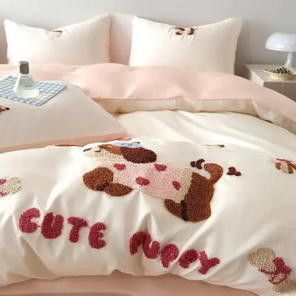 Cream-colored cotton bedding set with decorbites cartoon embroidery of brown and pink puppy in pastel pink outfit