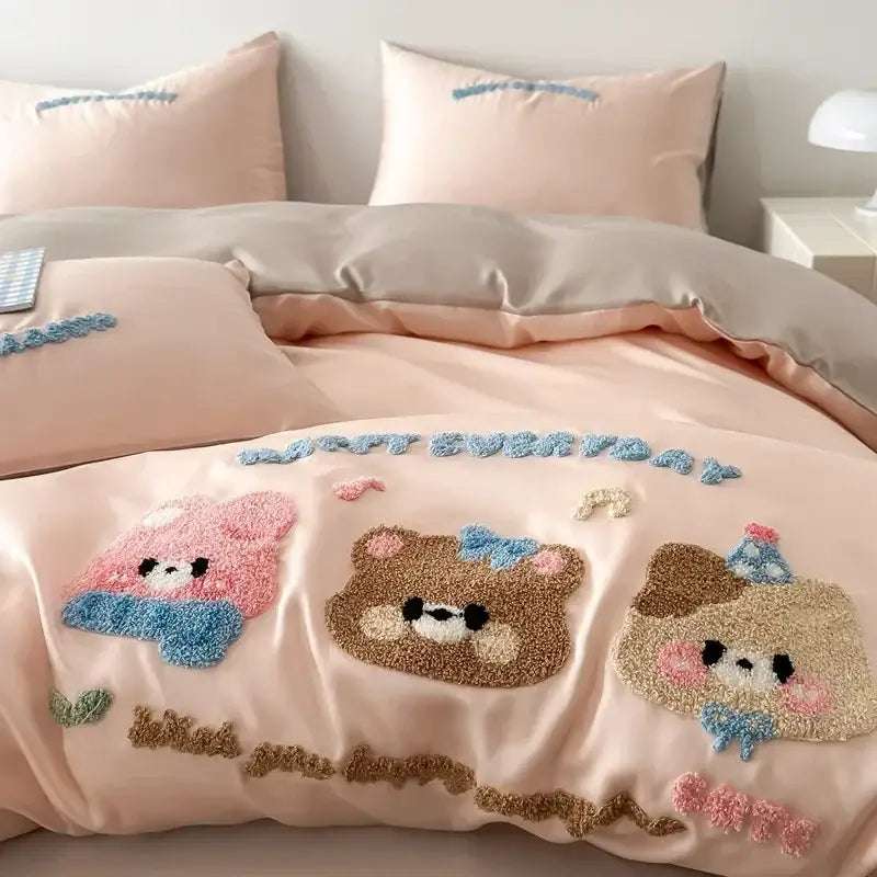 Pastel pink satin duvet cover with plush embroidered cartoon animals and blue bows in decorbites cartoon embroidery cotton bedding set
