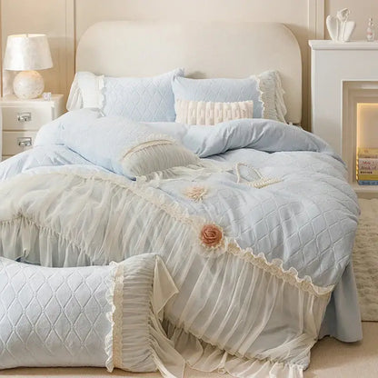 Light blue quilted bedding set with delicate lace trim and floral appliqués from decorbites cozy velvet lace collection