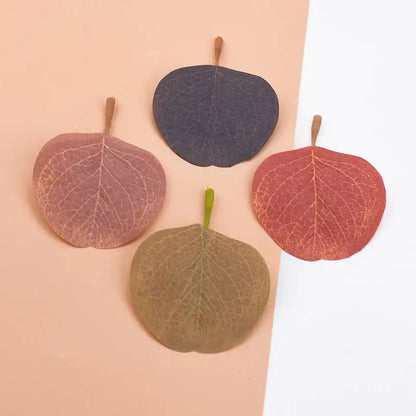 Four decorative pressed leaves in muted pink, purple, red, and brown tones silk leaf artificial plants for home decor